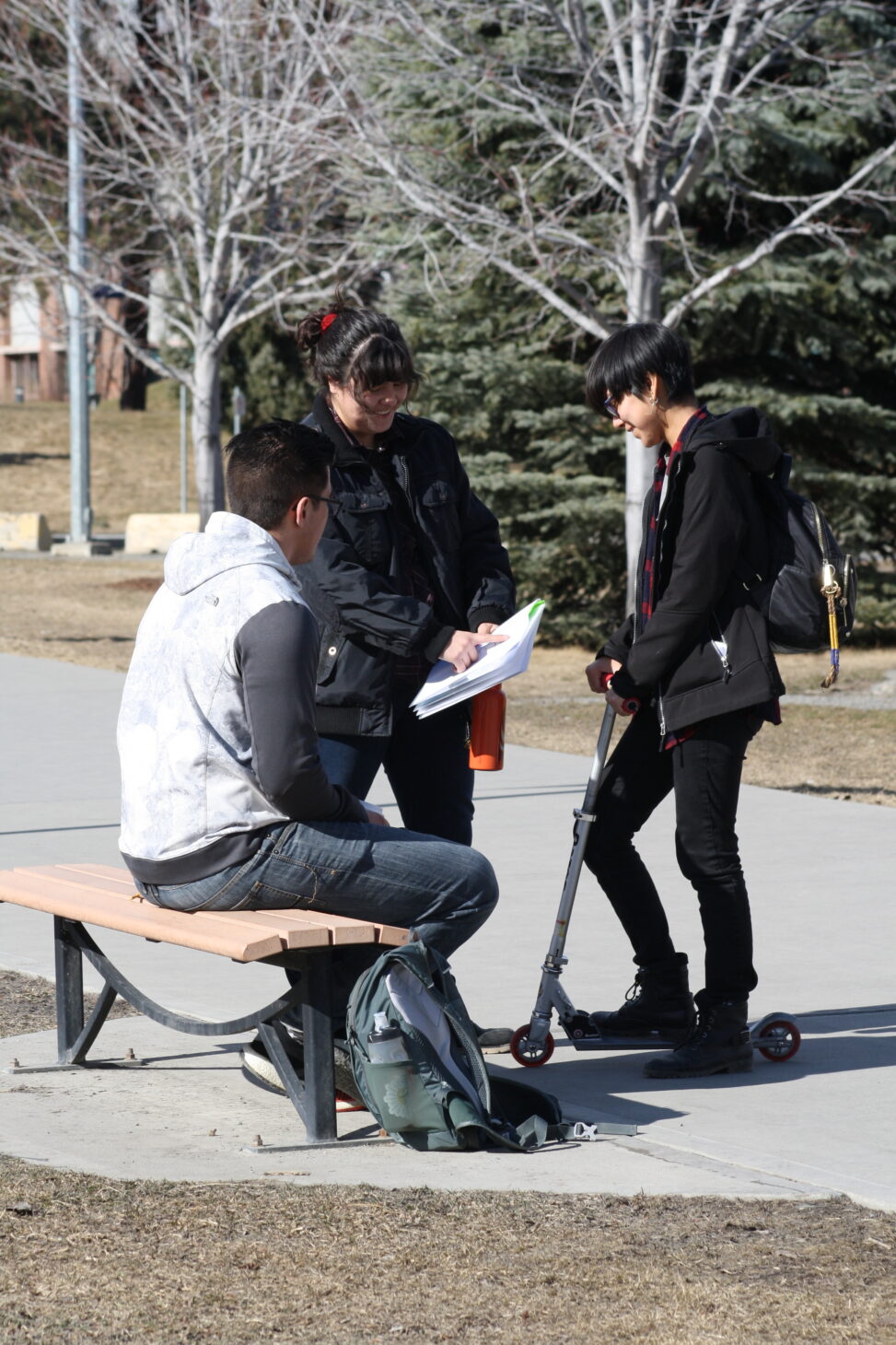 Indigenous students outside on campus.