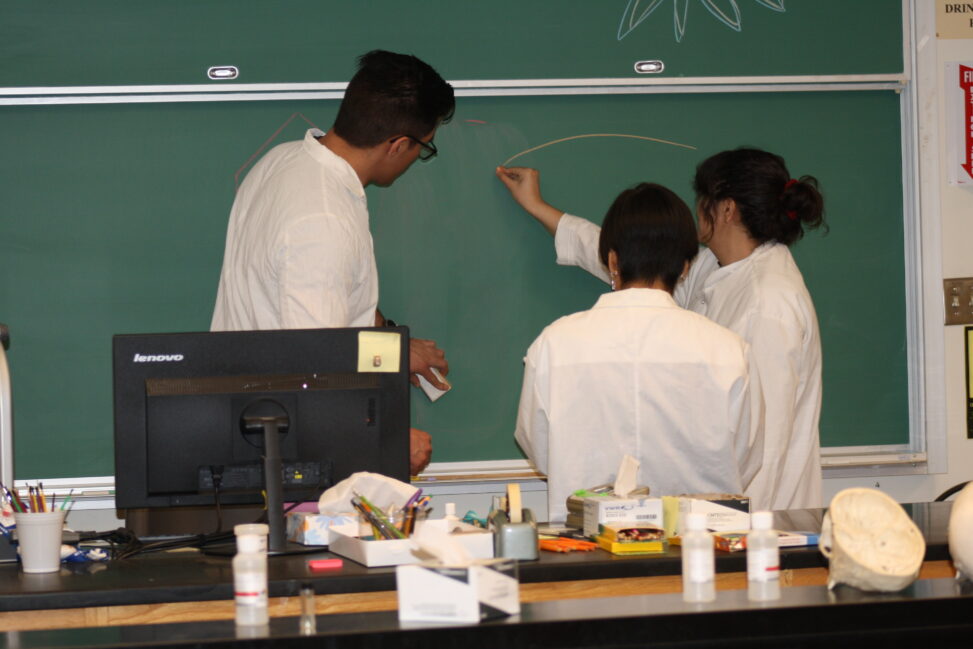 Indigenous students in a biology lab.