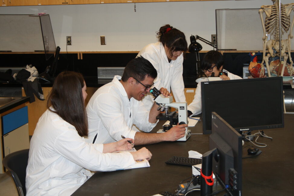 Indigenous students in a biology lab.