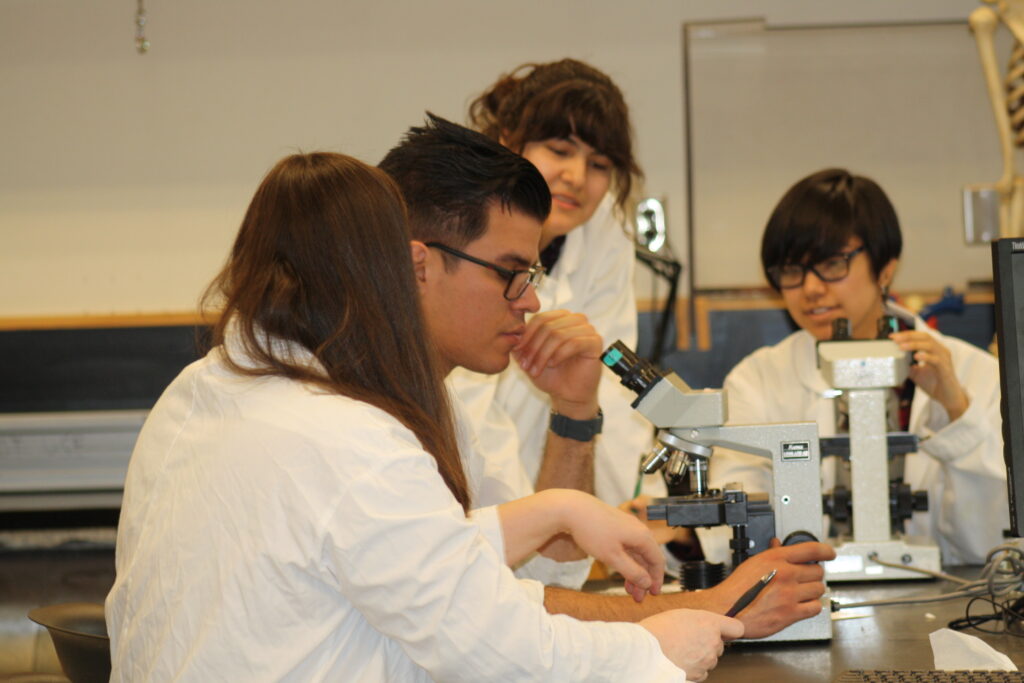 Indigenous students in a biology lab.