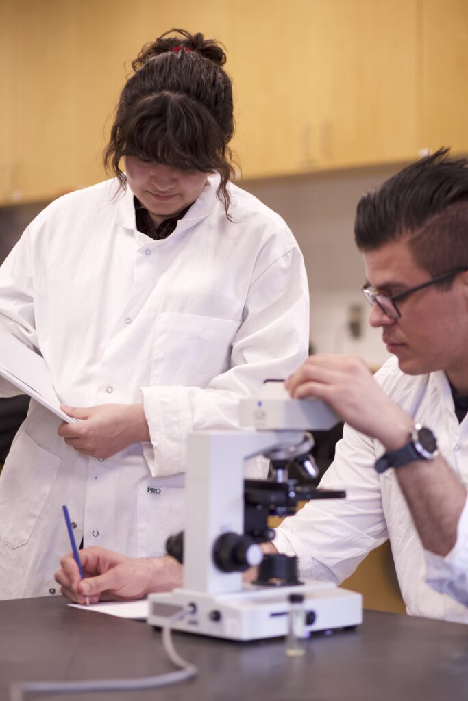 Indigenous students in a biology lab.