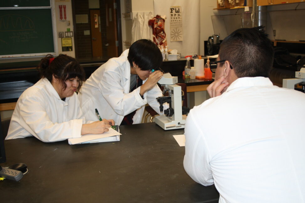 Indigenous students in a biology lab.
