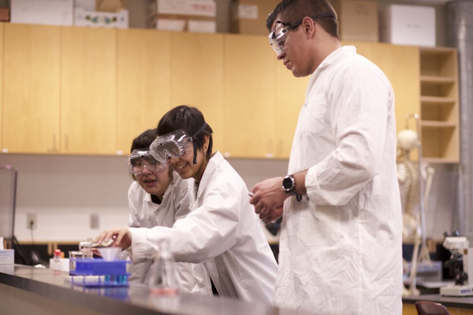 Indigenous students in a biology lab.
