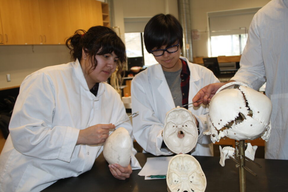 Indigenous students in a biology lab.
