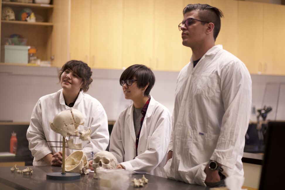 Indigenous students in a biology lab.