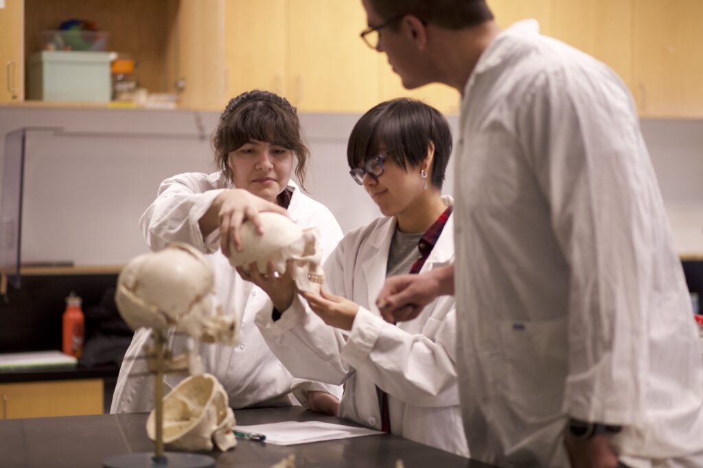 Indigenous students in a biology lab.